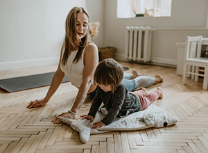 Mom doing yoga with child